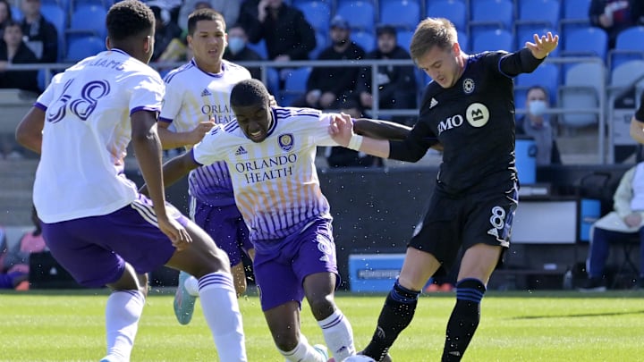 May 7, 2022; Montreal, Quebec, CAN; CF Montreal midfielder Djordje Mihailovic (right) controls the