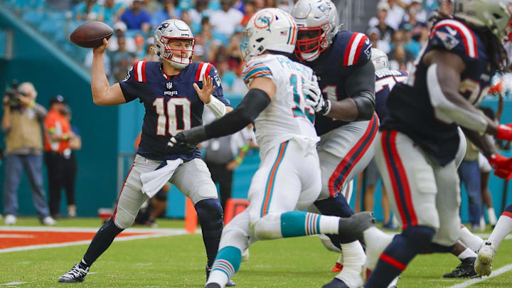 New England Patriots quarterback Mac Jones (10) throws the football against the Miami Dolphins during the third quarter at Hard Rock Stadium in October 2023. New England Patriots quarterback Mac Jones (10) throws the football against the Miami Dolphins during the third quarter at Hard Rock Stadium in October 2023.