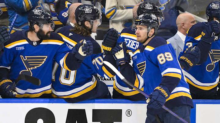 Apr 24, 2025; St. Louis, Missouri, USA; St. Louis Blues left wing Pavel Buchnevich (89) is congratulated by teammates after scoring against the Winnipeg Jets during the first period in game three of the first round of the 2025 Stanley Cup Playoffs at Enterprise Center. Mandatory Credit: Jeff Curry-Imagn Images