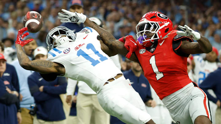 Jan 1, 2026; New Orleans, LA, USA; Mississippi Rebels wide receiver Deuce Alexander (11) attempts to make a catch defended by Georgia Bulldogs defensive back Ellis Robinson IV (1) in the first quarter during the 2026 Sugar Bowl and quarterfinal game of the College Football Playoff at Caesars Superdome. Mandatory Credit: Amber Searls-Imagn Images