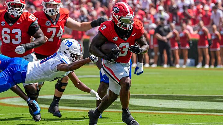 Sep 5, 2026; Athens, Georgia, USA; Georgia Bulldogs running back Nate Frazier (3) breaks a tackle by Tennessee State Tigers safety Joshua Reese (19) on his way to a touchdown during the first quarter at Sanford Stadium. Mandatory Credit: Dale Zanine-Imagn Images