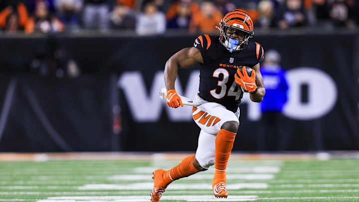 Dec 28, 2024; Cincinnati, Ohio, USA; Cincinnati Bengals running back Khalil Herbert (34) runs with the ball against the Denver Broncos in overtime at Paycor Stadium. Mandatory Credit: Katie Stratman-Imagn Images