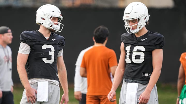 Quarterbacks Quinn Ewers and Arch Manning talk during the first Texas Longhorns football practice of 2023. Quarterbacks Quinn Ewers and Arch Manning talk during the first Texas Longhorns football practice of 2023.