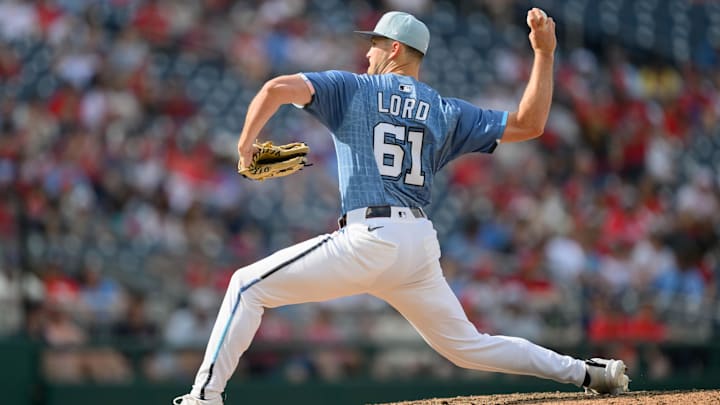 Mar 29, 2025; Washington, District of Columbia, USA; Washington Nationals pitcher Brad Lord (61) throws a pitch during the ninth inning against the Philadelphia Phillies at Nationals Park.