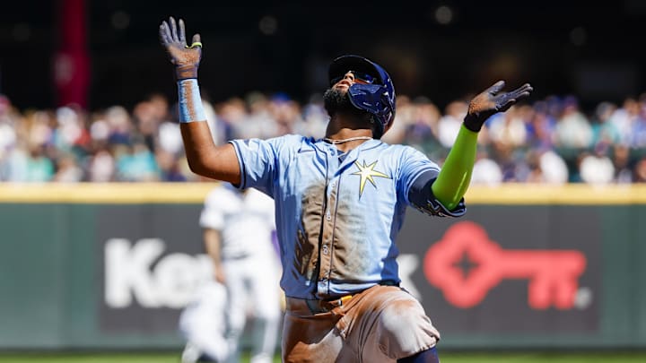 Seattle, Washington, USA; Tampa Bay Rays third baseman Junior Caminero (13) reacts after hitting a triple against the Seattle Mariners during the first inning at T-Mobile Park.