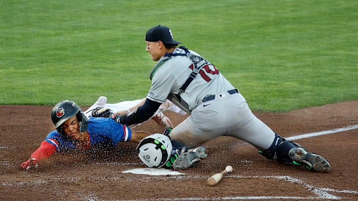 Rochester’s Andrew Pinckney is tagged out trying to score on a squeeze play by Scranton catcher Rafael Flores.