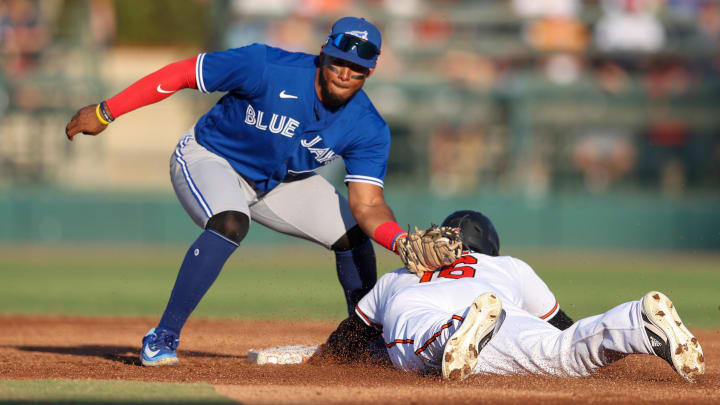 Mar 16, 2023; Sarasota, Florida, USA;  Baltimore Orioles left fielder Franchy Cordero (16) steals second base from Toronto Blue Jays second baseman Leo Jimenez (49) in the second inning during spring training at Ed Smith Stadium.
