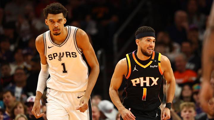 Dec 3, 2024; Phoenix, Arizona, USA; Phoenix Suns guard Devin Booker (right) against San Antonio Spurs center Victor Wembanyama in the first half of an NBA Cup game at Footprint Center. Mandatory Credit: Mark J. Rebilas-Imagn Images
Dec 3, 2024; Phoenix, Arizona, USA; Phoenix Suns guard Devin Booker (right) against San Antonio Spurs center Victor Wembanyama in the first half of an NBA Cup game at Footprint Center. Mandatory Credit: Mark J. Rebilas-Imagn Images