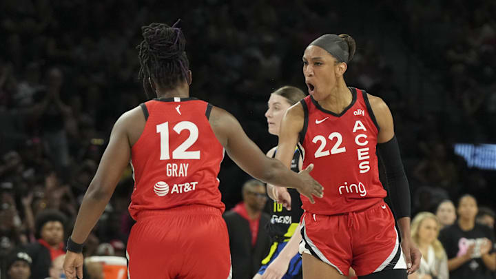 Aug 17, 2025; Las Vegas, Nevada, USA; Las Vegas Aces center A'ja Wilson (22) celebrates with guard Chelsea Gray (12) against the Dallas Wings in the second quarter at Michelob Ultra Arena. Mandatory Credit: Candice Ward-Imagn Images