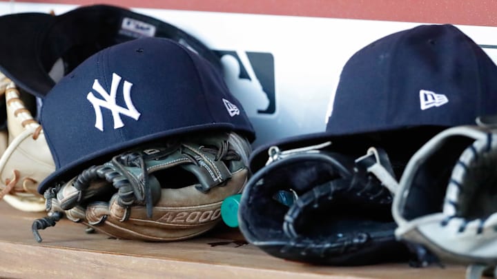 Jun 18, 2018; Washington, DC, USA; New York Yankees players caps and gloves rest in the dugout against the Washington Nationals at Nationals Park. Mandatory Credit: Geoff Burke-Imagn Images Jun 18, 2018; Washington, DC, USA; New York Yankees players caps and gloves rest in the dugout against the Washington Nationals at Nationals Park. Mandatory Credit: Geoff Burke-Imagn Images