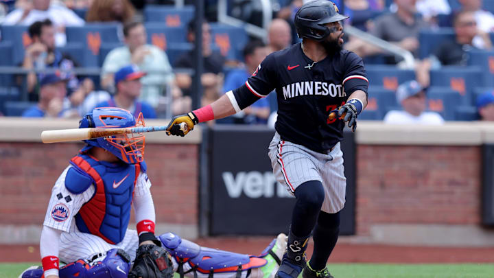 Jul 31, 2024; New York City, New York, USA; Minnesota Twins first baseman Carlos Santana (30) follows through on an RBI double against the New York Mets during the fifth inning at Citi Field. Mandatory Credit: Brad Penner-Imagn Images