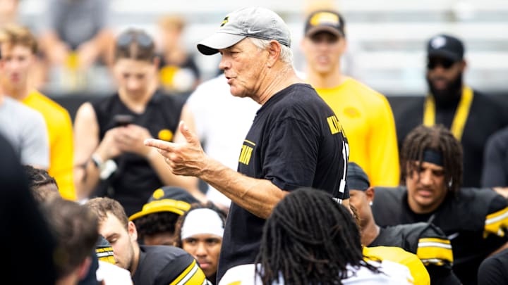 Aug 9, 2025; Iowa head coach Kirk Ferentz talks with players during the Hawkeyes Kids Day NCAA football open practice at Kinnick Stadium in Iowa City, Iowa. Mandatory Credit: Joseph Cress for the Des Moines Register