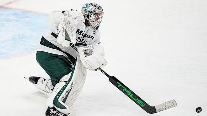 Michigan State goaltender Trey Augustine (1) hits the puck away against Michigan during the second period of Duel in the D at Little Caesars Arena in Detroit on Saturday, February 7, 2026. Michigan State goaltender Trey Augustine (1) hits the puck away against Michigan during the second period of Duel in the D at Little Caesars Arena in Detroit on Saturday, February 7, 2026.