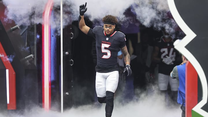 Oct 27, 2024; Houston, Texas, USA; Houston Texans safety Jalen Pitre (5) runs onto the field before the game against the Indianapolis Colts at NRG Stadium. Mandatory Credit: Troy Taormina-Imagn Images