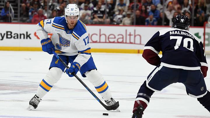 Oct 3, 2026; Denver, Colorado, USA; St. Louis Blues defenseman Cam Fowler (17) skates with the puck against Colorado Avalanche defenseman Sam Malinski (70)  during the first period at Ball Arena. Mandatory Credit: Christopher Hanewinckel-Imagn Images