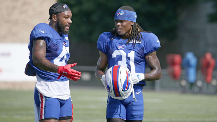 Bills veteran defensive back Christian Benford talks with rookie Maxwell Hairston between drills.