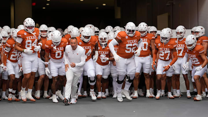 Sep 20, 2025; Austin, Texas, USA; Texas Longhorns head coach Steve Sarkisian leads his team on to the field before a game against the Sam Houston State Bearkats at Darrell K Royal-Texas Memorial Stadium. Mandatory Credit: Scott Wachter-Imagn Images