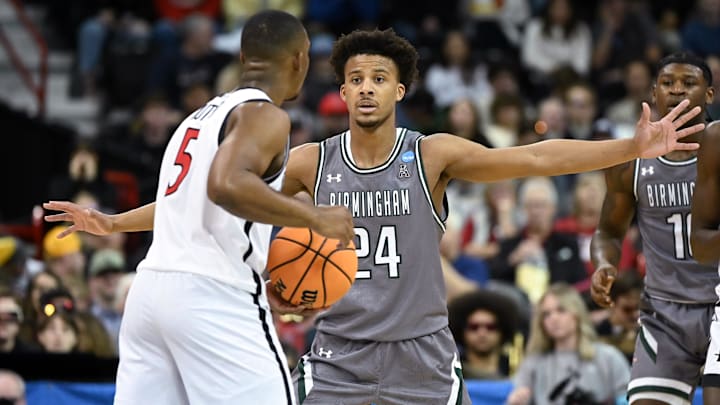 Mar 22, 2024; Spokane, WA, USA; UAB Blazers guard Efrem Johnson (24) defends San Diego State Aztecs guard Lamont Butler (5) during the second half in the first round of the 2024 NCAA Tournament at Spokane Veterans Memorial Arena. 
