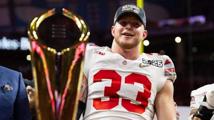 Jan 20, 2025; Atlanta, GA, USA; Ohio State Buckeyes defensive end Jack Sawyer (33) celebrates after defeating the Notre Dame Fighting Irish in the CFP National Championship college football game at Mercedes-Benz Stadium. Mandatory Credit: Mark J. Rebilas-Imagn Images