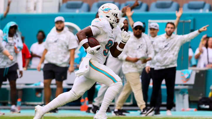 Nov 17, 2024; Miami Gardens, Florida, USA; Miami Dolphins tight end Jonnu Smith (9) runs with the football for a touchdown against the Las Vegas Raiders during the fourth quarter at Hard Rock Stadium. 