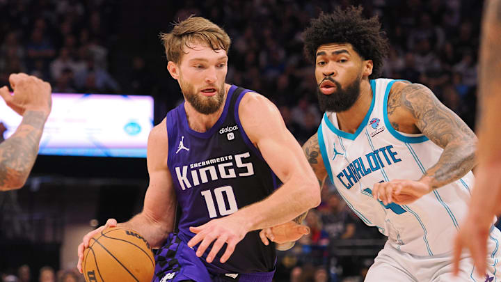 Jan 2, 2024; Sacramento, California, USA; Sacramento Kings center Domantas Sabonis (10) controls the ball against Charlotte Hornets center Nick Richards (4) during the second quarter at Golden 1 Center. Mandatory Credit: Kelley L Cox-Imagn Images Jan 2, 2024; Sacramento, California, USA; Sacramento Kings center Domantas Sabonis (10) controls the ball against Charlotte Hornets center Nick Richards (4) during the second quarter at Golden 1 Center. Mandatory Credit: Kelley L Cox-Imagn Images