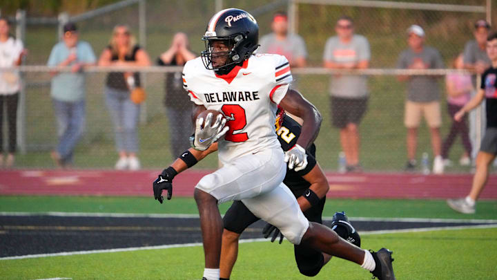 Sep 13, 2024; Sunbury, Ohio, USA; Delaware Hayes Favour Akih (2) runs the ball in for a touchdown against Big Walnut in the first half at Big Walnut High School.
