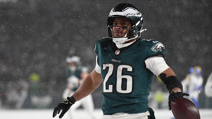 Jan 19, 2025; Philadelphia, Pennsylvania, USA; Philadelphia Eagles running back Saquon Barkley (26) celebrates after scoring a touchdown against the Los Angeles Rams in the second half in a 2025 NFC divisional round game at Lincoln Financial Field. Mandatory Credit: Eric Hartline-Imagn Images