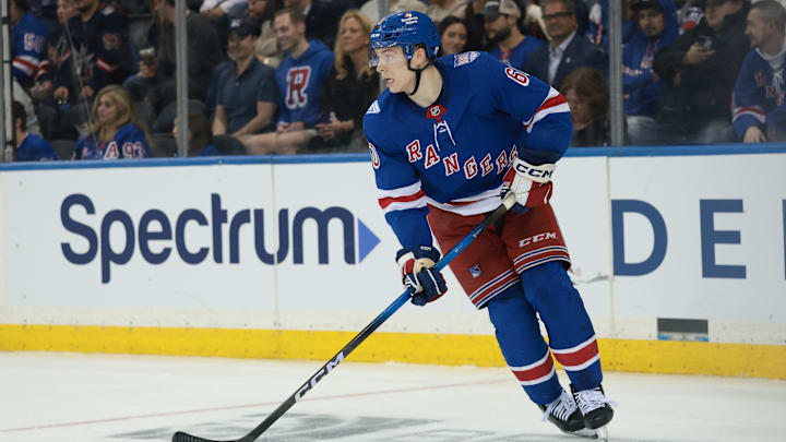 Sep 23, 2025; New York, New York, USA; New York Rangers defenseman Scott Morrow (60) plays the puck during the third period of a preseason game against the Boston Bruins at Madison Square Garden. Mandatory Credit: Vincent Carchietta-Imagn Images