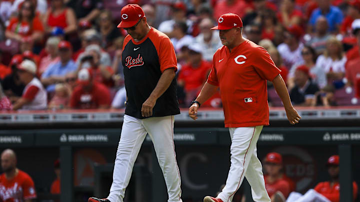 Sep 25, 2025; Cincinnati, Ohio, USA; Cincinnati Reds manager Terry Francona (77) and pitching coach Derek Johnson (36) walk onto the field during a pitching change in the seventh inning against the Pittsburgh Pirates at Great American Ball Park. Mandatory Credit: Katie Stratman-Imagn Images