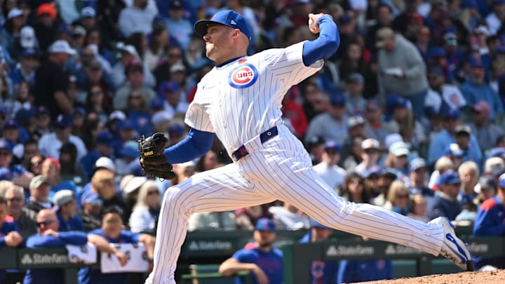 May 26, 2025; Chicago, Illinois, USA; Chicago Cubs relief pitcher Caleb Thielbar (24) pitches during a game against the Colorado Rockies at Wrigley Field.