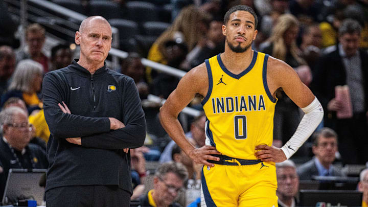 Oct 30, 2023; Indianapolis, Indiana, USA; Indiana Pacers head coach Rick Carlisle and guard Tyrese Haliburton (0) look on in the second half against the Chicago Bulls at Gainbridge Fieldhouse. Mandatory Credit: Trevor Ruszkowski-USA TODAY Sports