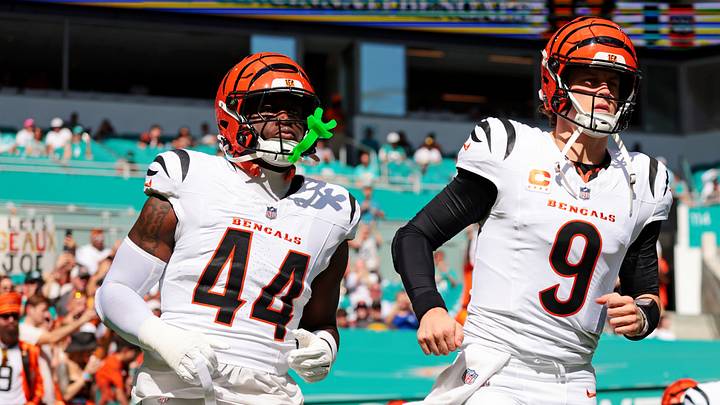 Dec 21, 2025; Miami Gardens, Florida, USA; Cincinnati Bengals quarterback Joe Burrow (9) and Cincinnati Bengals linebacker Demetrius Knight Jr. (44) enter the field before the game against the Miami Dolphins at Hard Rock Stadium. Mandatory Credit: Sam Navarro-Imagn Images