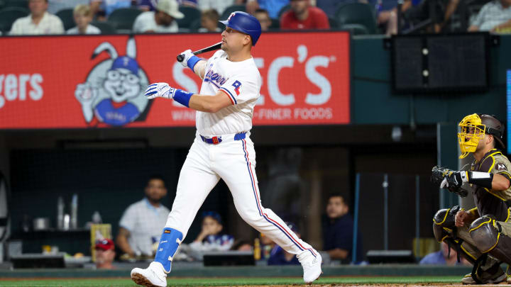 Jul 2, 2024; Arlington, Texas, USA;  Texas Rangers first baseman Nathaniel Lowe (30) hits a two-run home run during the first inning against the San Diego Padres at Globe Life Field. Mandatory Credit: Kevin Jairaj-USA TODAY Sports