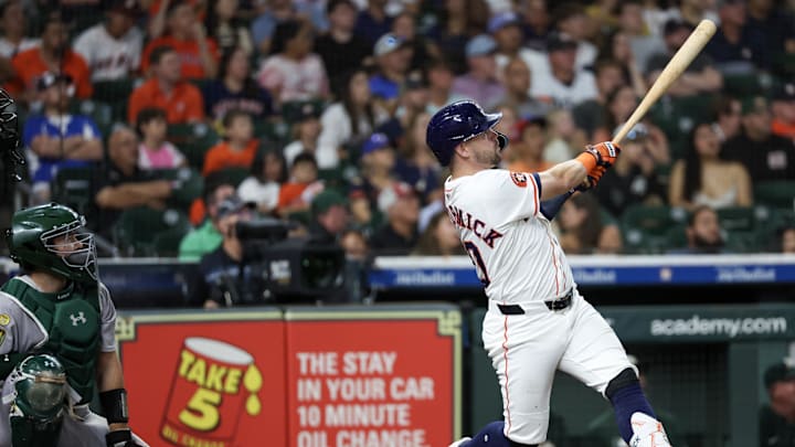 May 27, 2025; Houston, Texas, USA; Houston Astros left fielder Chas McCormick (20) hits a RBI double against the Athletics in the second inning at Daikin Park. Mandatory Credit: Thomas Shea-Imagn Images
