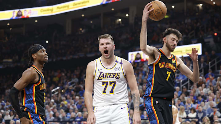 Apr 6, 2025; Oklahoma City, Oklahoma, USA; Los Angeles Lakers guard Luka Doncic (77) yells after scoring against the Oklahoma City Thunder during the second quarter at Paycom Center. Mandatory Credit: Alonzo Adams-Imagn Images