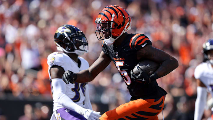 Oct 6, 2024; Cincinnati, Ohio, USA; Cincinnati Bengals wide receiver Tee Higgins (5) scores a touchdown during the first quarter against the Baltimore Ravens at Paycor Stadium. Oct 6, 2024; Cincinnati, Ohio, USA; Cincinnati Bengals wide receiver Tee Higgins (5) scores a touchdown during the first quarter against the Baltimore Ravens at Paycor Stadium.