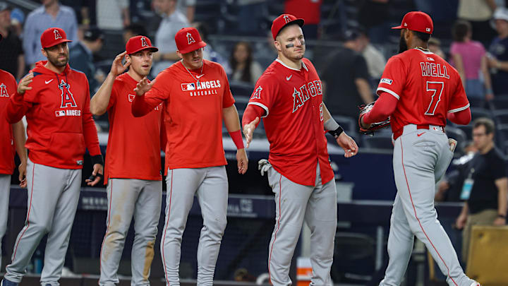 Jun 18, 2025; Bronx, New York, USA; Los Angeles Angels center fielder Jo Adell (7) and designated hitter Mike Trout (27) celebrate with teammates after defeating the New York Yankees at Yankee Stadium. Mandatory Credit: Vincent Carchietta-Imagn Images