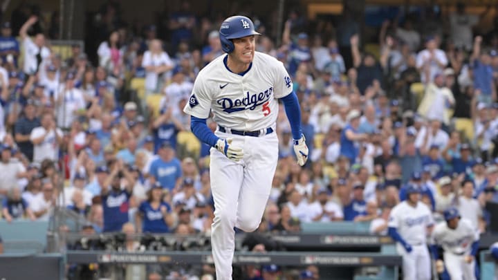 Oct 11, 2024; Los Angeles, California, USA; Los Angeles Dodgers first baseman Freddie Freeman (5) runs after hitting a single in the first inning during game five of the NLDS for the 2024 MLB Playoffs at Dodger Stadium.