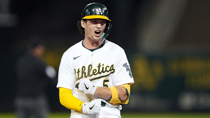 Sep 6, 2024; Oakland, California, USA; Oakland Athletics shortstop Jacob Wilson (5) reacts after hitting an RBI-triple against the Detroit Tigers during the fifth inning at Oakland-Alameda County Coliseum. Mandatory Credit: Darren Yamashita-Imagn Images