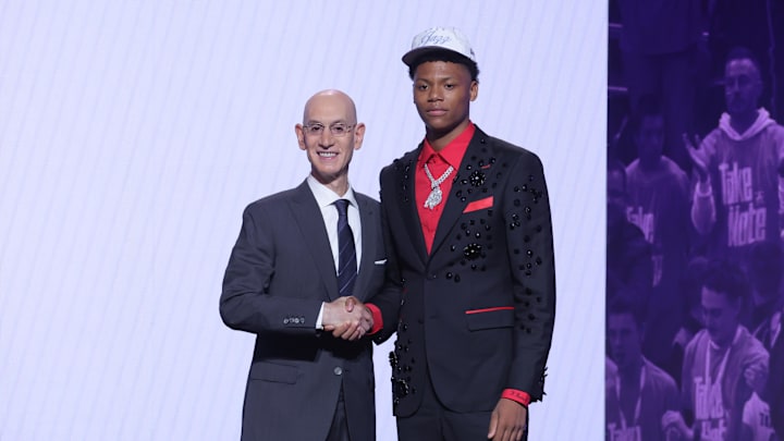 Jun 25, 2025; Brooklyn, NY, USA;  Ace Bailey stands with NBA commissioner Adam Silver after being selected as the fifth pick by the Utah Jazz in the first round of the 2025 NBA Draft at Barclays Center. Mandatory Credit: Brad Penner-Imagn Images