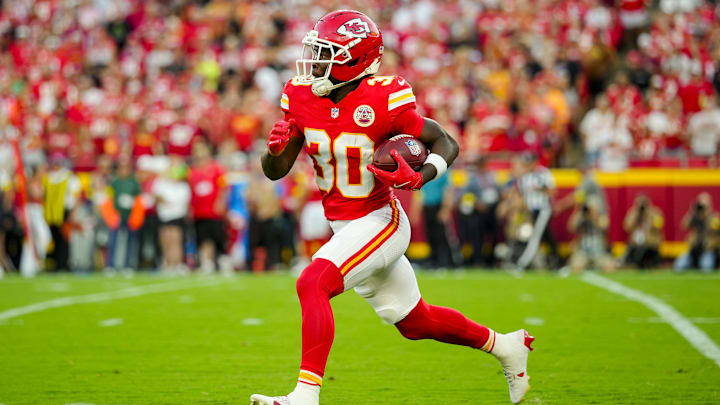 Aug 22, 2025; Kansas City, Missouri, USA; Kansas City Chiefs running back Brashard Smith (30) returns a kickoff during the first half against the Chicago Bears at GEHA Field at Arrowhead Stadium. Mandatory Credit: Jay Biggerstaff-Imagn Images