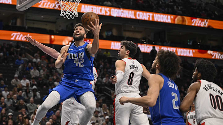 Jan 9, 2025; Dallas, Texas, USA; Dallas Mavericks forward Maxi Kleber (42) drives to the basket past Portland Trail Blazers forward Deni Avdija (8) during the second half at the American Airlines Center. Mandatory Credit: Jerome Miron-Imagn Images