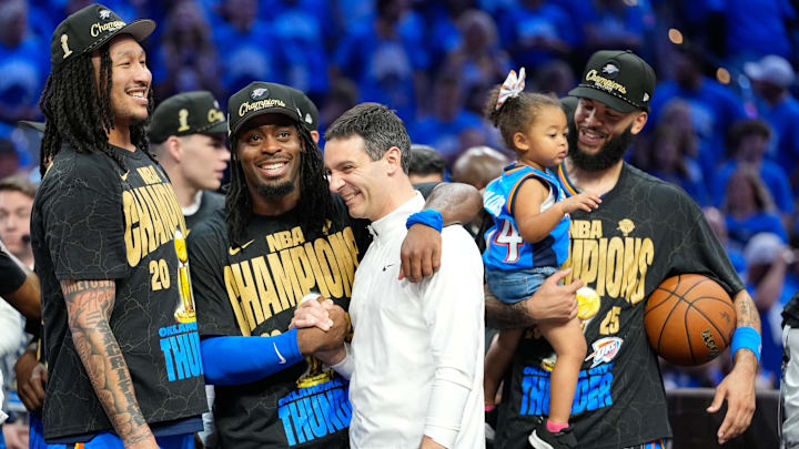 Jun 22, 2025; Oklahoma City, Oklahoma, USA; Oklahoma City Thunder guard Luguentz Dort (5) with head coach Mark Daigneault after winning game seven of the 2025 NBA Finals against the Indiana Pacers at Paycom Center. Mandatory Credit: Kyle Terada-Imagn Images
