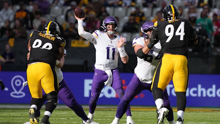 Sep 28, 2025; Dublin, Ireland; Minnesota Vikings quarterback Carson Wentz (11) throws the ball against Pittsburgh Steelers defensive end Demarvin Leal (98) and defensive tackle Yahya Black (94) during an NFL International Series game at Croke Park. Mandatory Credit: Kirby Lee-Imagn Images
