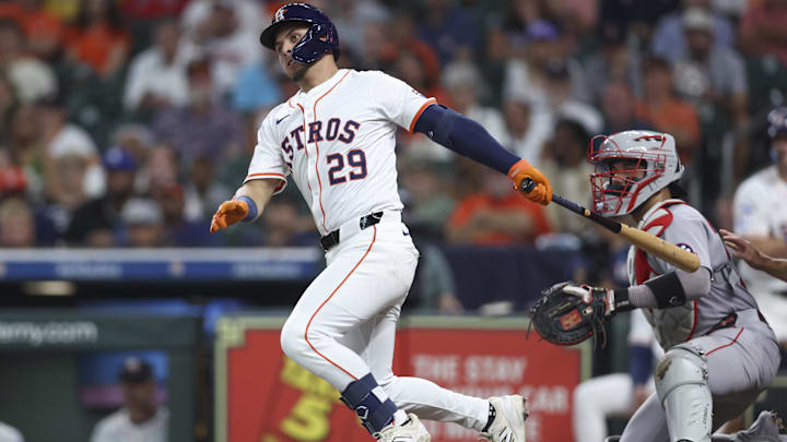 Aug 12, 2025; Houston, Texas, USA; Houston Astros second baseman Ramon Urias (29) hits a single during the second inning against the Boston Red Sox at Daikin Park. 