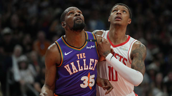 Mar 30, 2025; Phoenix, Arizona, USA; Phoenix Suns forward Kevin Durant (35) and Houston Rockets forward Jabari Smith Jr. (10) fight for position in the first half at Footprint Center. Mandatory Credit: Rick Scuteri-Imagn Images