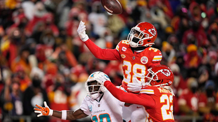 Jan 13, 2024; Kansas City, Missouri, USA; Kansas City Chiefs cornerback L'Jarius Sneed (38) and cornerback Trent McDuffie (22) break up a pass intended for Miami Dolphins wide receiver Tyreek Hill (10) during the second half of the 2024 AFC wild card game at GEHA Field at Arrowhead Stadium. Mandatory Credit: Jay Biggerstaff-Imagn Images