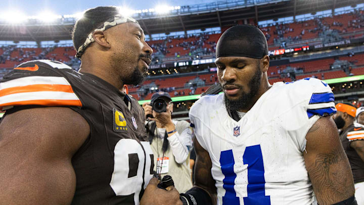 Cleveland Browns defensive end Myles Garrett congratulates Dallas Cowboys linebacker Micah Parsons