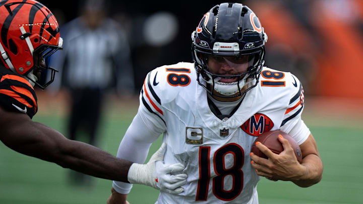 Chicago Bears quarterback Caleb Williams (18) runs by Cincinnati Bengals linebacker Oren Burks (42) in the fourth quarter of the NFL football game between Chicago Bears and Cincinnati Bengals at Paycor Stadium in Cincinnati on Nov. 2, 2025.