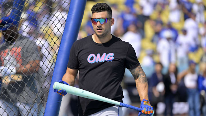 Oct 14, 2024; Los Angeles, California, USA; New York Mets second baseman Jose Iglesias (11) warms up before game two against the Los Angeles Dodgers in the NLCS for the 2024 MLB Playoffs at Dodger Stadium. Mandatory Credit: Jayne Kamin-Oncea-Imagn Images